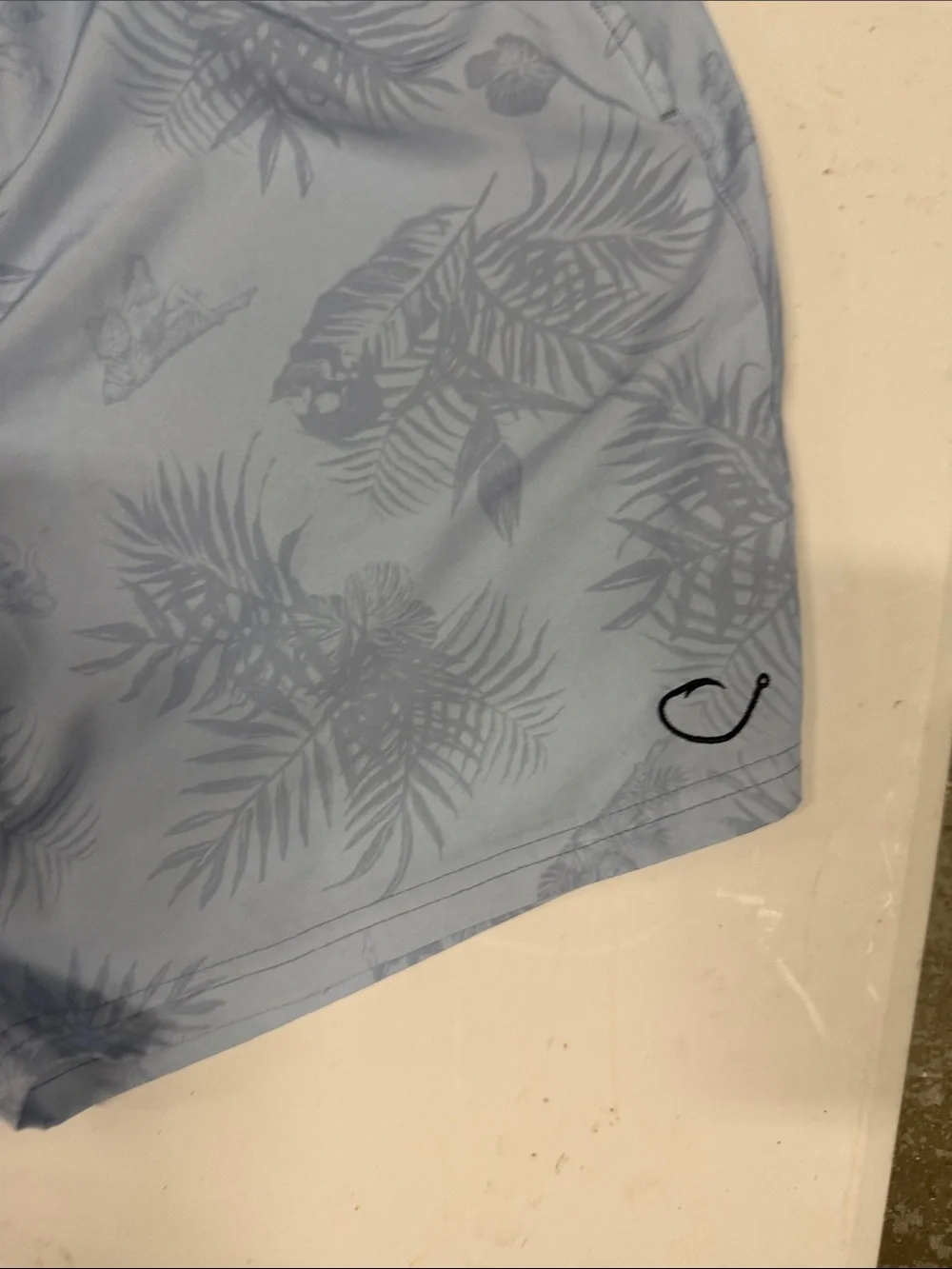 Light Blue Tropical Print Swim Trunks with Navy Waistband